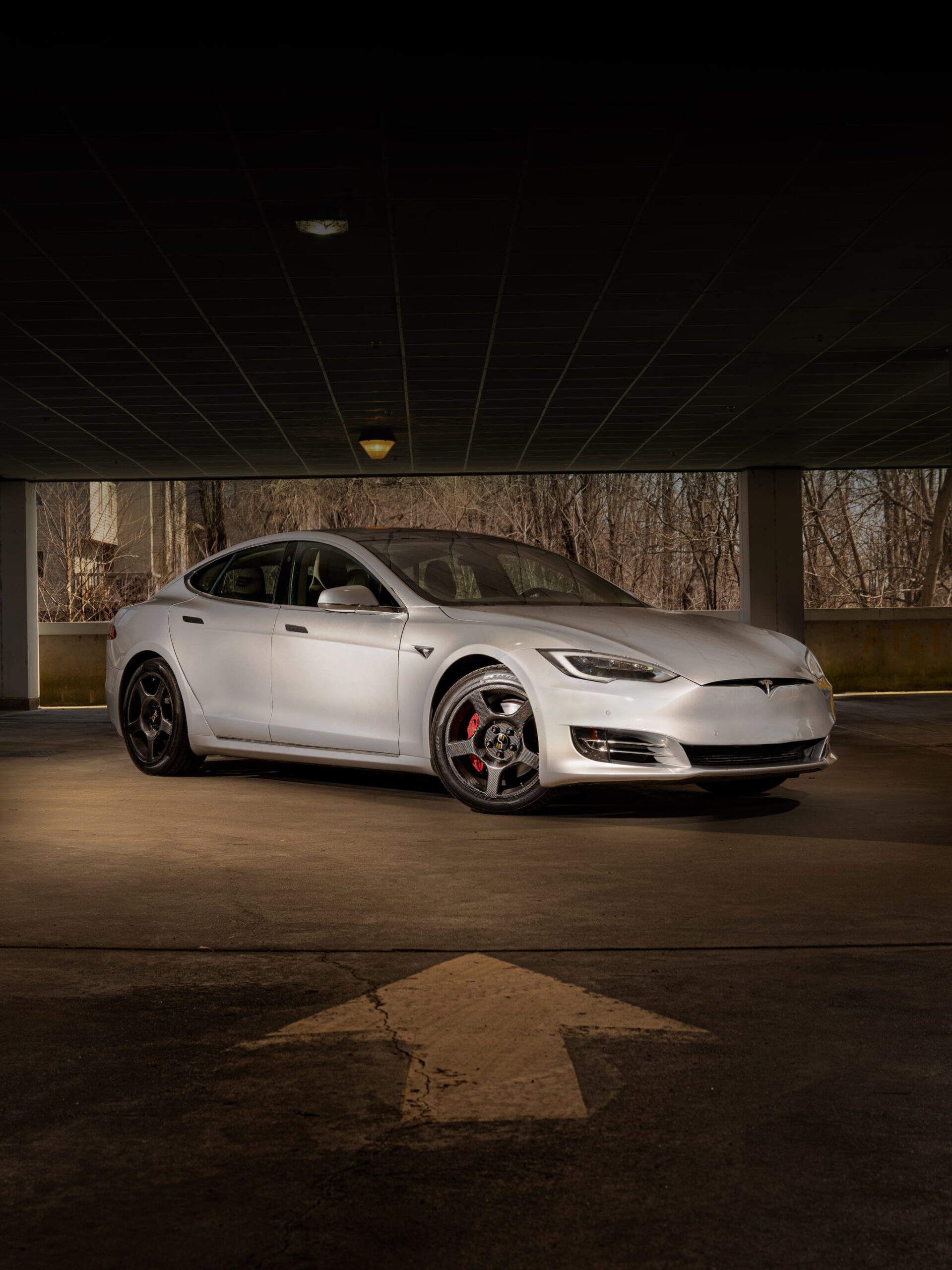 a white Tesla with carbon fiber wheels