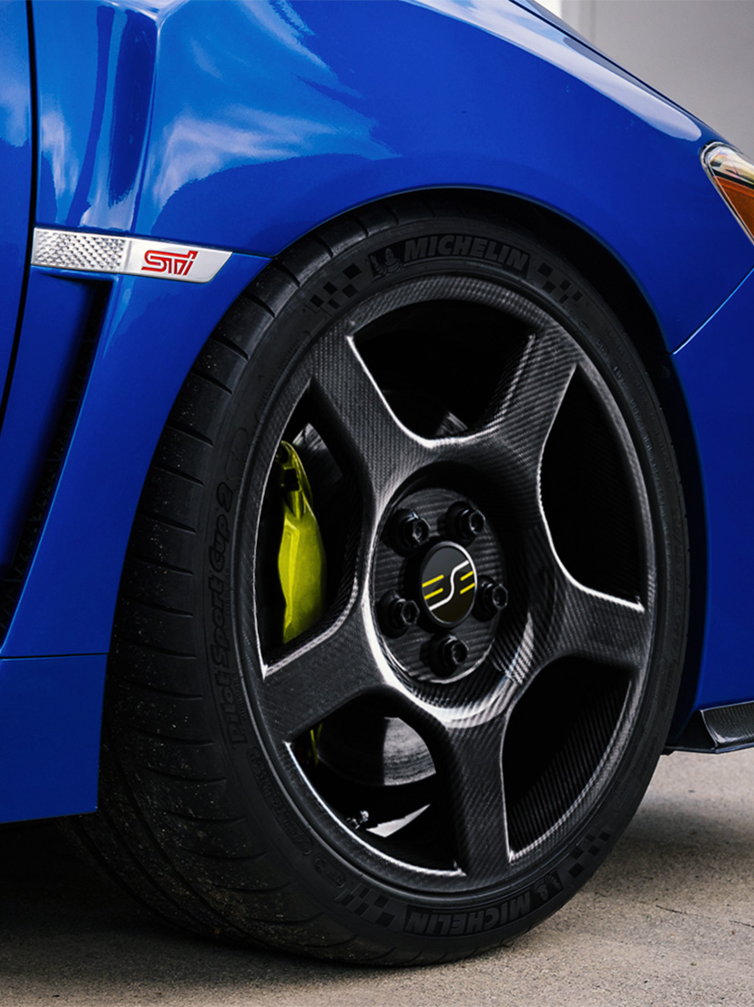 Subaru WRX sedan with ESE Carbon fiber wheels.