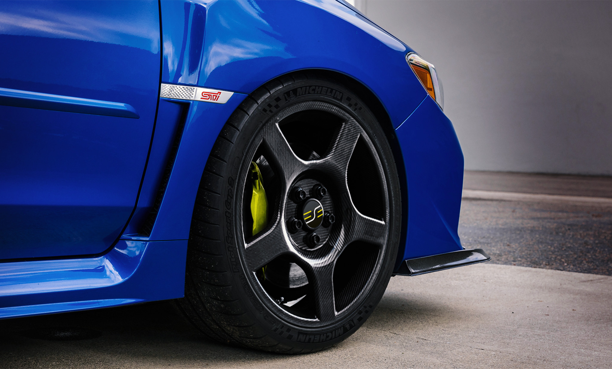 Subaru WRX sedan with ESE Carbon fiber wheels.